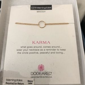 Dogeared gold circle bracelet with tag